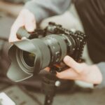 black and gray dslr camera with stability lens
